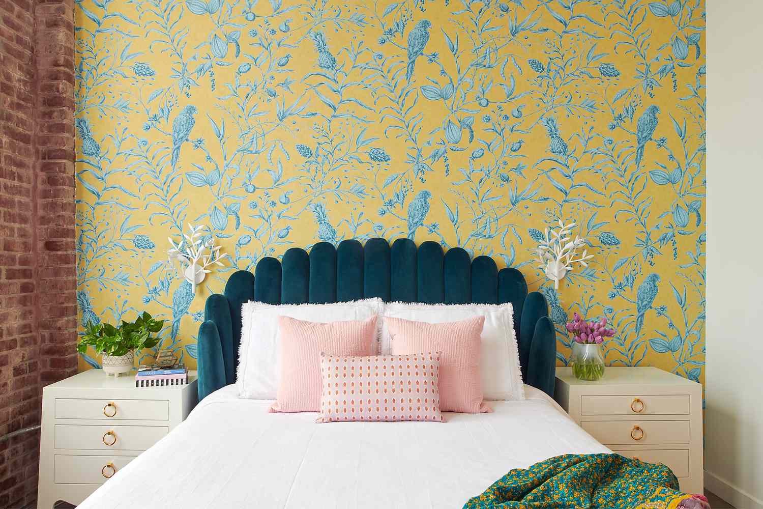 Vibrant floral accent wall in a bedroom